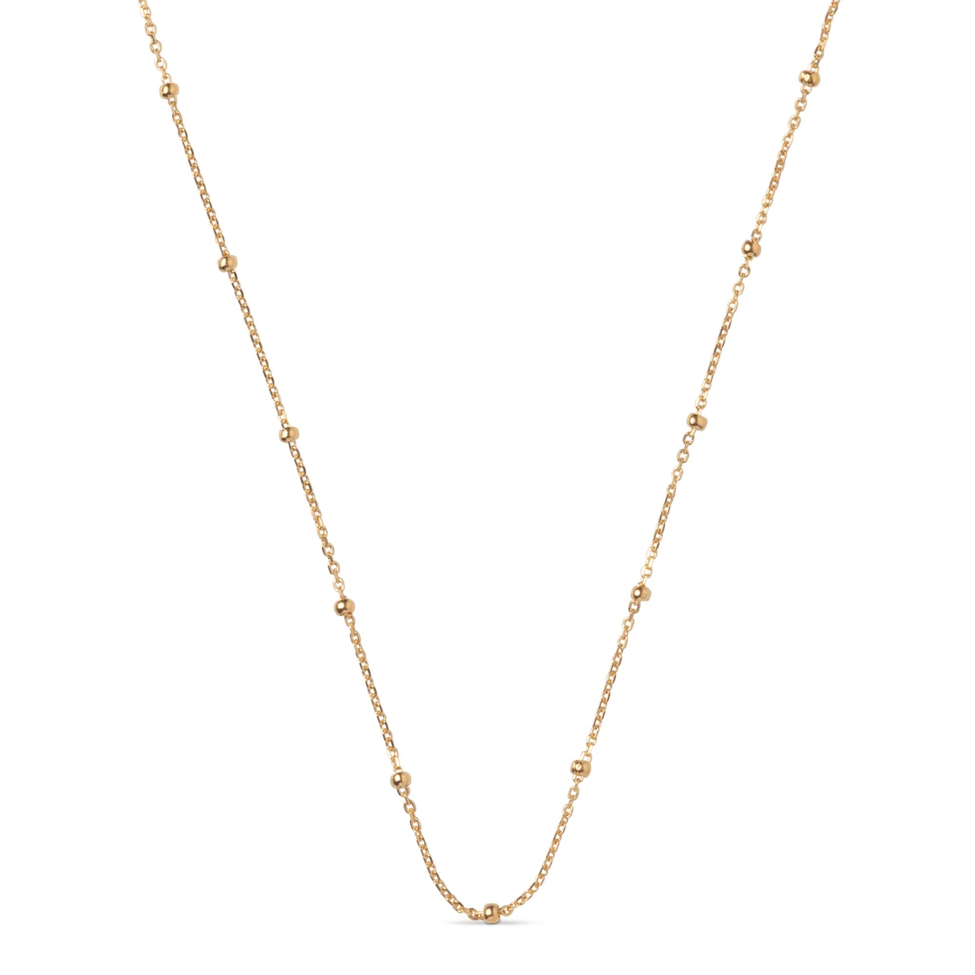 Gold chain necklace on a white background