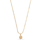 Gold necklace with a clover-shaped pendant on a white background