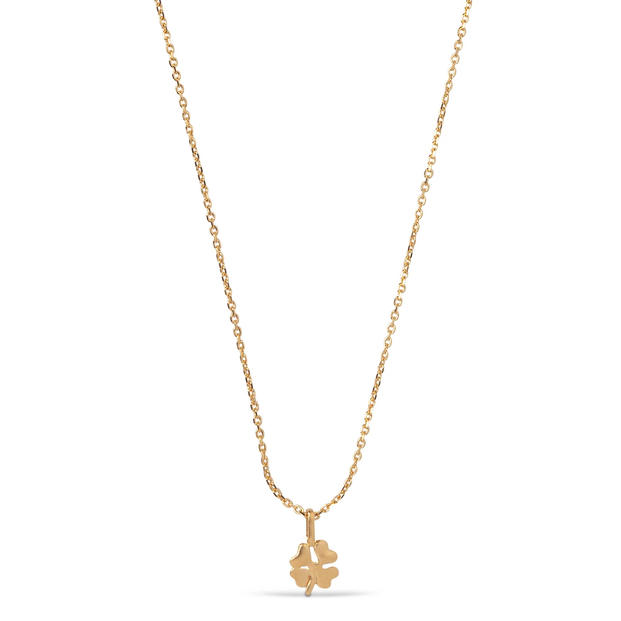 Gold necklace with a clover-shaped pendant on a white background