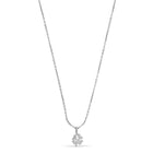 Silver necklace with a clover pendant on a white background