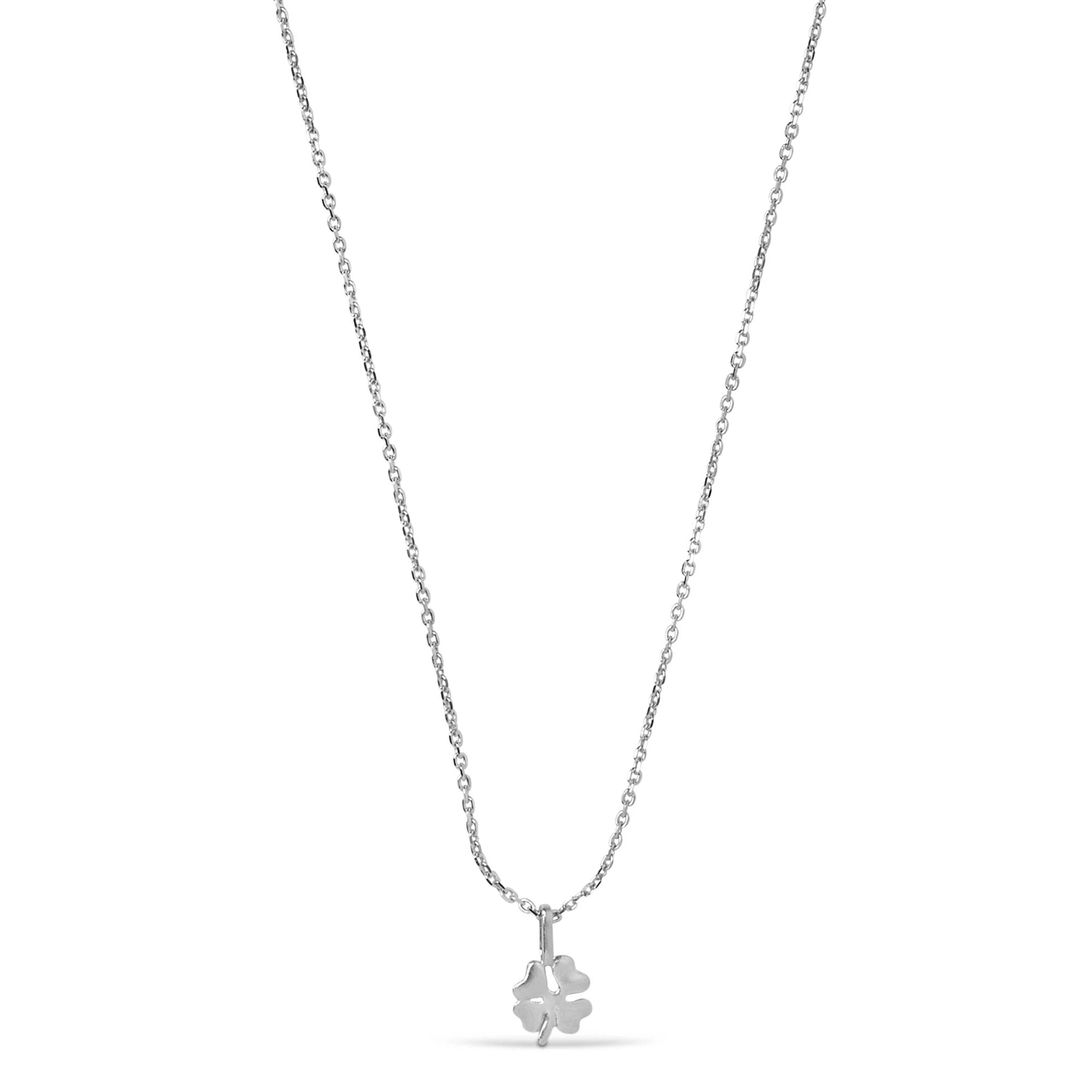 Silver necklace with a clover pendant on a white background