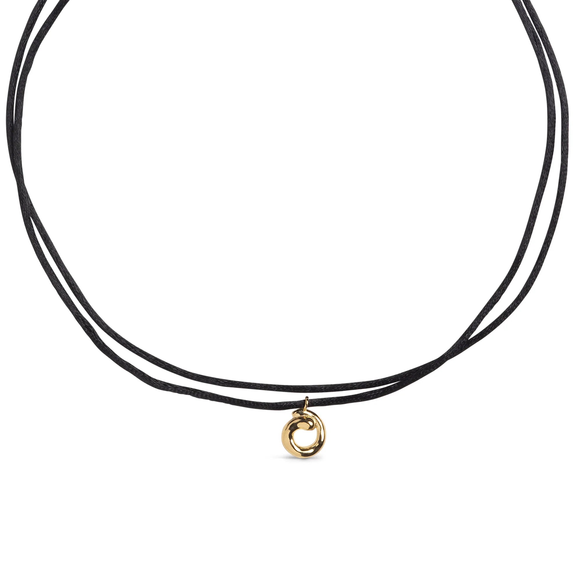 Black cord necklace with a gold pendant on a white background