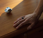 Men's hand with a one-of-a-kind ring composed of niobium and black tourmaline by ASR JWLS.