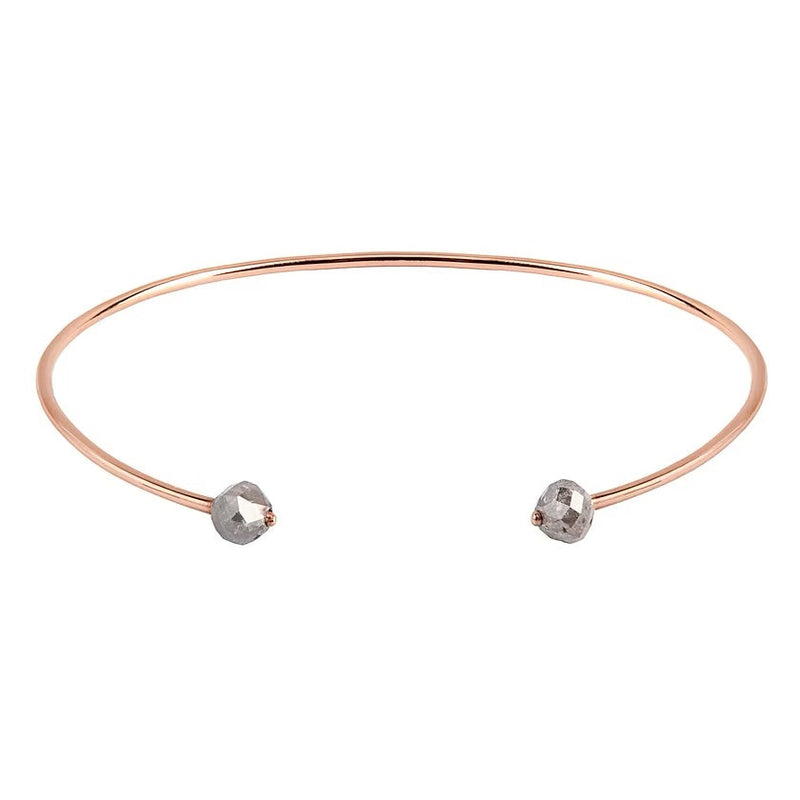 A thin rose gold open cuff bangle bracelet with two small faceted grey diamonds at the ends, shown on a plain white background.