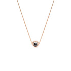 A delicate rose gold chain necklace featuring a small circular pendant with a gold outer ring and a dark, nearly black, faceted diamond, shown against a plain white background.