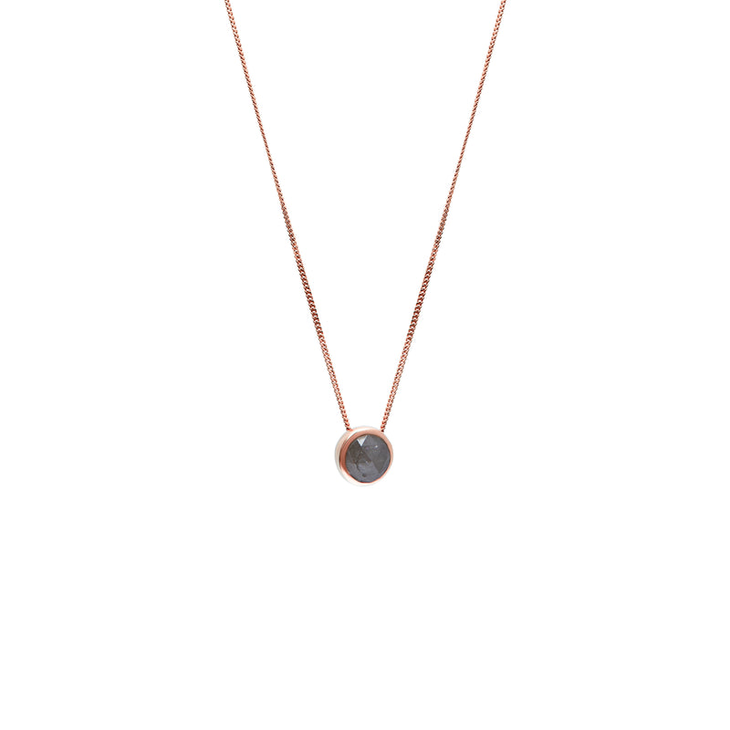 A delicate gold chain necklace with a small bezel-set rose-cut grey diamond pendant, shown against a plain white background.