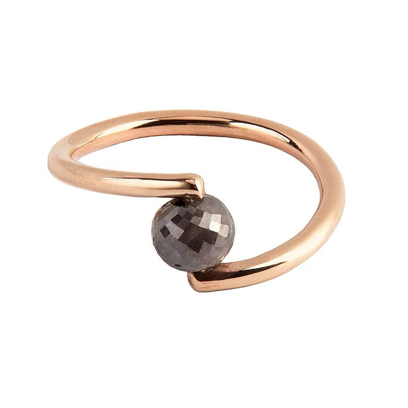 A rose gold open wrap ring featuring a faceted black diamond, shown on a plain white background.