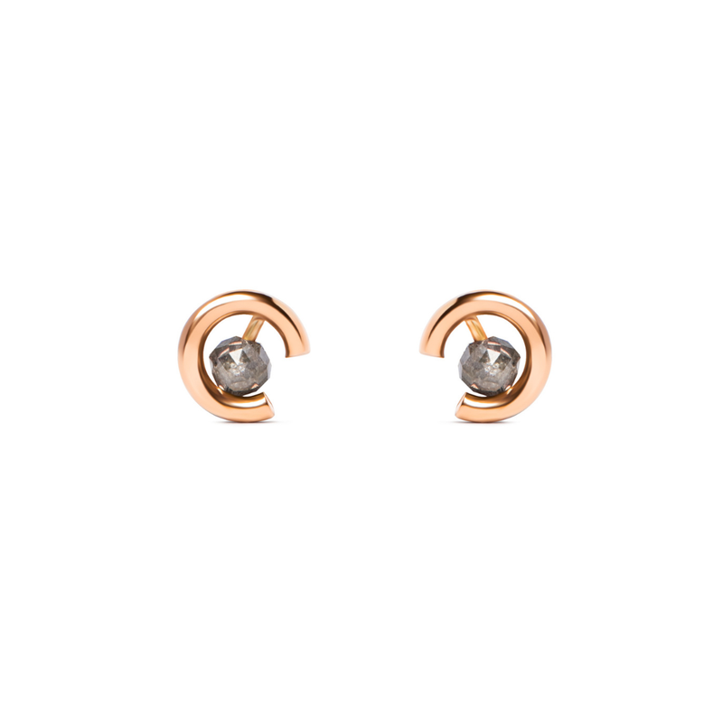 A pair of gold crescent-shaped stud earrings with round grey diamonds, shown on a plain white background.

