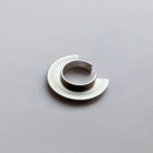 Silver ear cuff on a gray background
