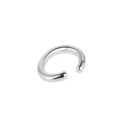 A polished silver-toned metal open-ended ring ear cuff, shown on a plain white background.
