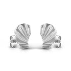 A pair of silver shell-shaped stud earrings shown from the back on a clean white background.