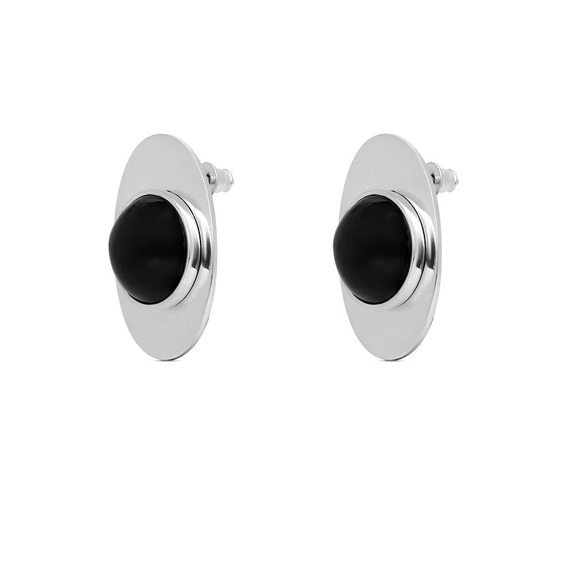 A pair of oval stud earrings with a polished silver-tone metal frame and a central blac kamber dome, shown against a plain white background.