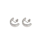A pair of silver huggie hoop earrings featuring a twisted design, shown on a plain white background.