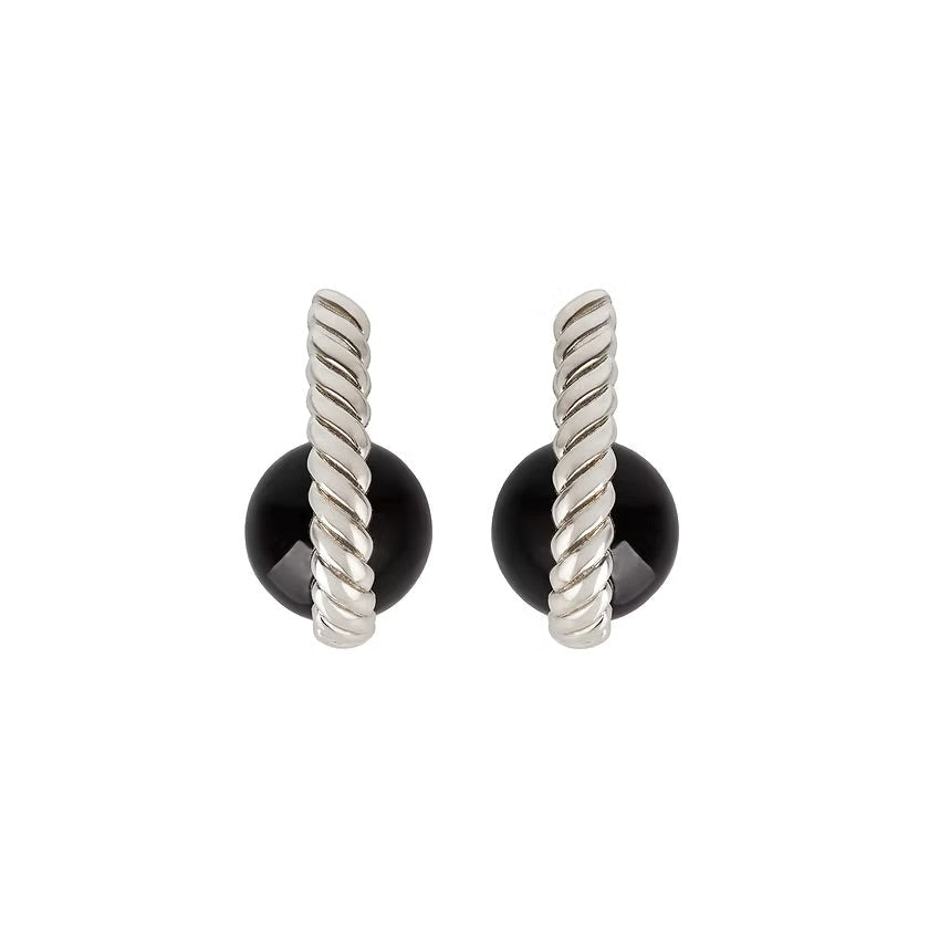 A pair of silver twisted cable post earrings with round black amber stones at the base, shown against a plain white background.