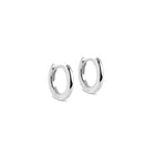Pair of silver hoop earrings on a white background