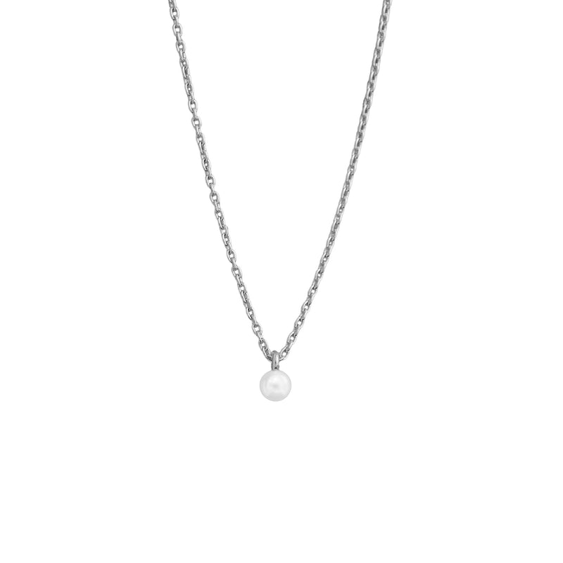 A delicate silver chain necklace with a single small white pearl pendant, shown against a plain white background.