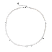 Freshwater pearl necklace with small silver-tone accents and a lobster clasp closure, shown on a plain white background.