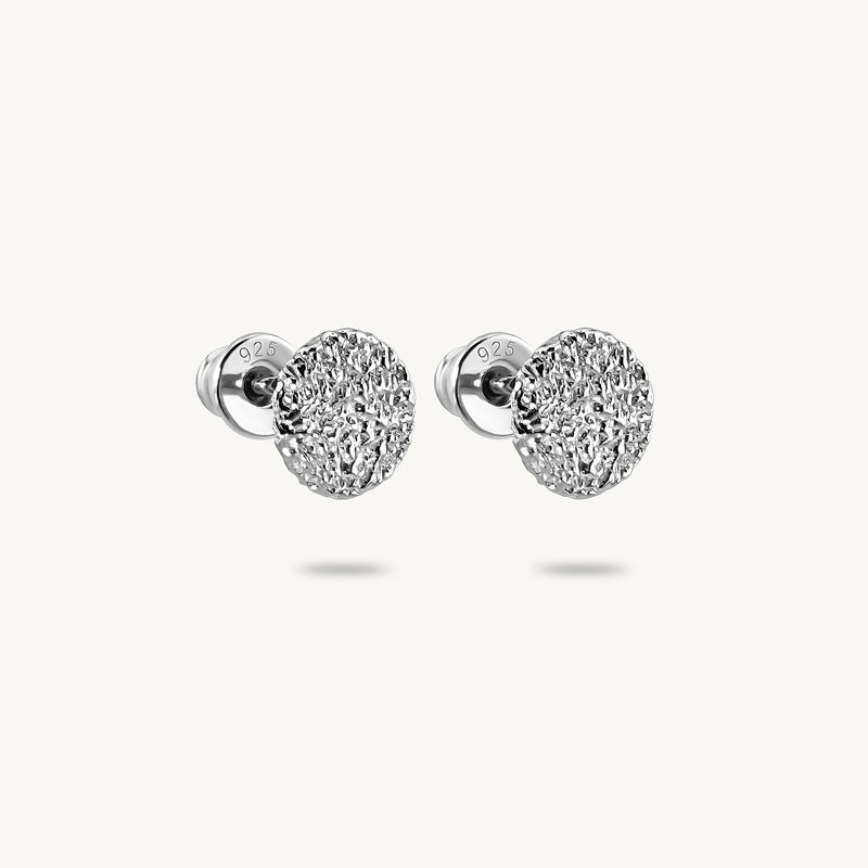 A pair of silver stud earrings, featuring a textured surface, on a clean white background.