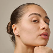 Close-up of a woman's face with a neutral background