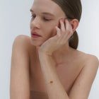 Silver bracelet with two asymmetrical Baltic ambers by Adele Notes.