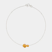 Silver bracelet with two asymmetrical Baltic ambers by Adele Notes.