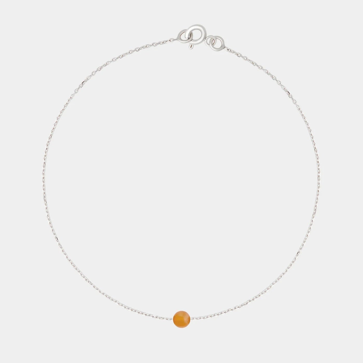 Silver bracelet with small Baltic amber by Adele Notes.