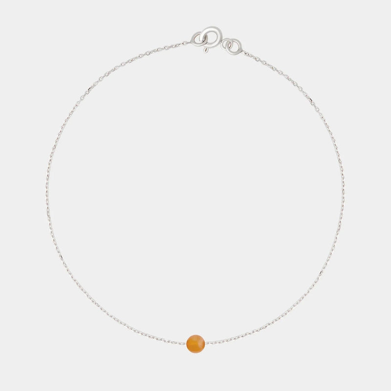 Silver bracelet with small Baltic amber by Adele Notes.