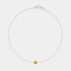 Gold bracelet with small Baltic amber by Adele Notes.