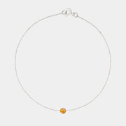 Gold bracelet with small Baltic amber by Adele Notes.