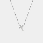 Silver cross necklace on a light gray background