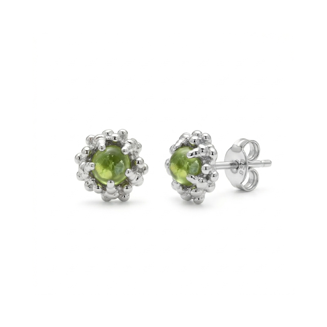 Pair of peridot stud earrings on a white background