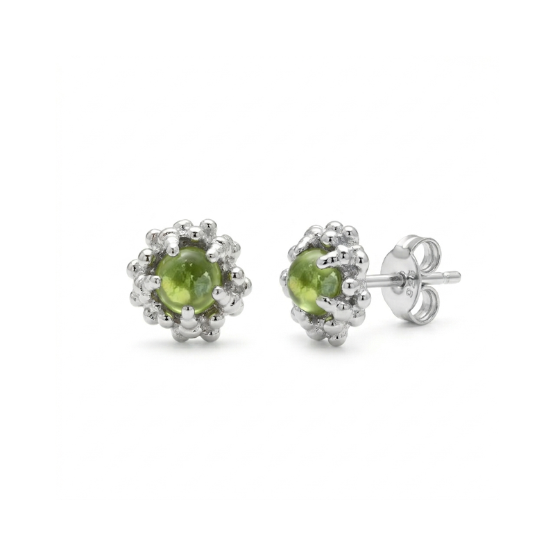 Pair of peridot stud earrings on a white background