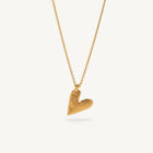 Gold heart-shaped pendant necklace on a white background