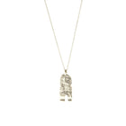 Silver totem pendant on delicate chain.