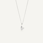A heart-shaped silver necklace with a pendant on a chain, displayed against a white background.