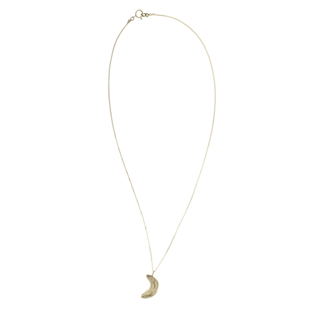 Silver necklace with a crescent moon pendant on a white background
