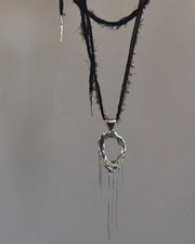 One-of-a-kind necklace featuring a unique water-cast sterling silver pendant with an organic, sculptural form and delicate linear drops. 