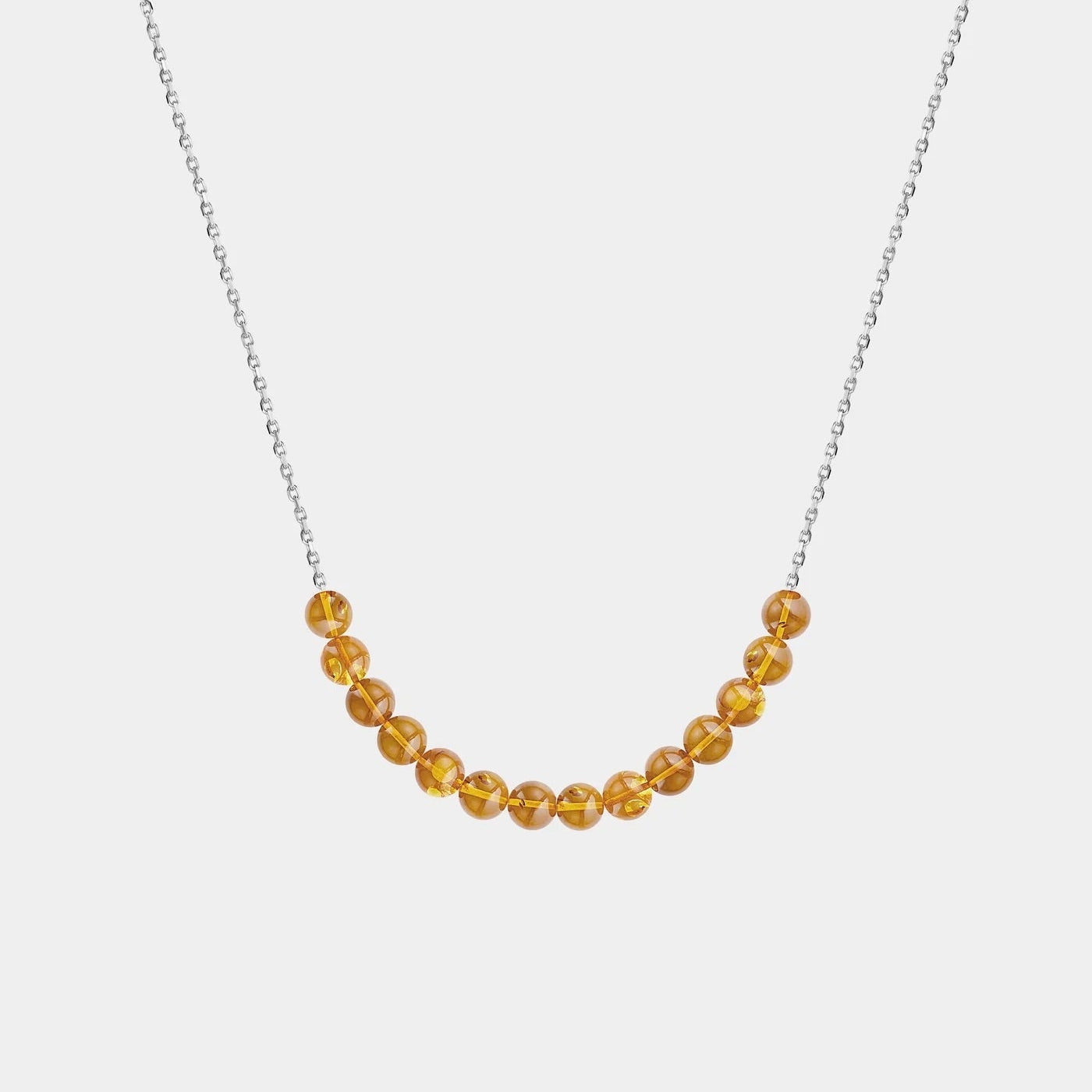 Necklace with Baltic amber beads on a white background