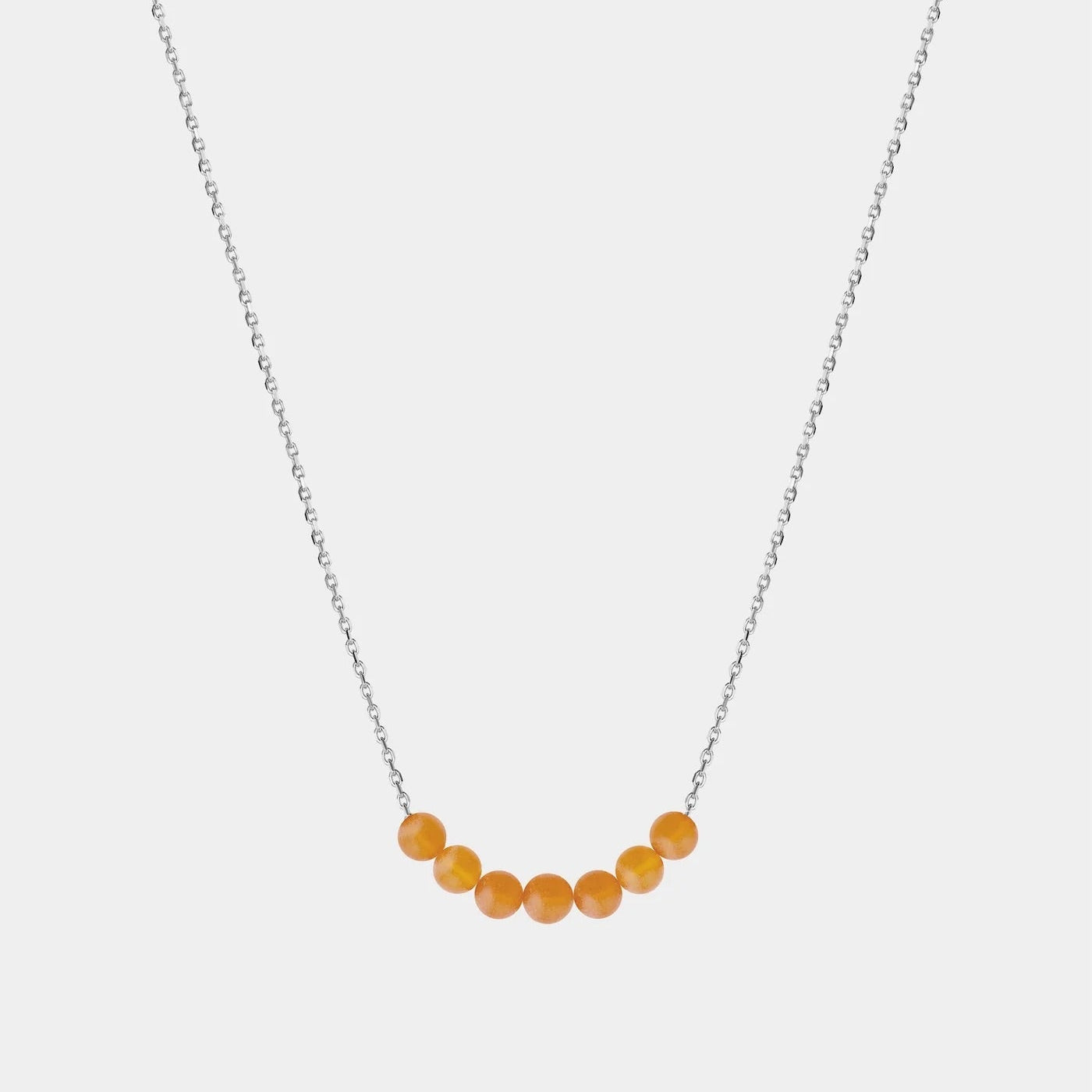 Necklace with Baltic amber beads on a white background