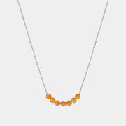 Necklace with Baltic amber beads on a white background