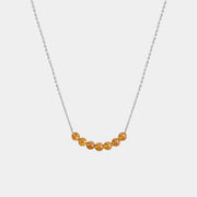 Necklace with Baltic amber beads on a white background