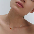 Silver necklace with two asymmetrical Baltic amber pendants by Adele Notes. 