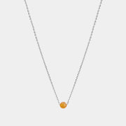 Silver necklace with small Baltic amber pendant by Adele Notes. 