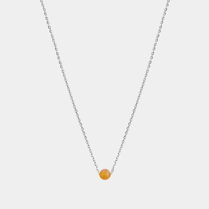 Silver necklace with small Baltic amber pendant by Adele Notes. 