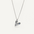 Silver heart-shaped pendant necklace with a blue sapphire on a white background