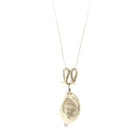 Infinity-shaped pendant featuring baroque shaped freshwater pearl. 