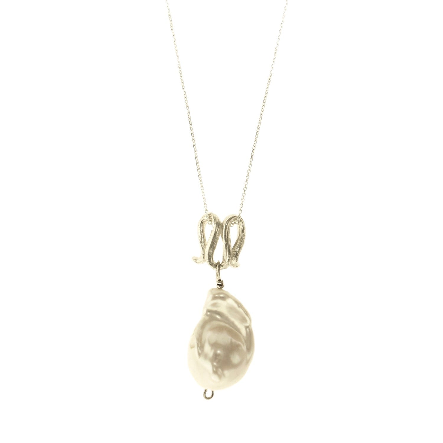 Infinity-shaped pendant featuring baroque shaped freshwater pearl. 