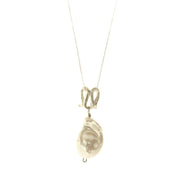 Infinity-shaped pendant featuring baroque shaped freshwater pearl. 