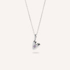 Heart-shaped silver pendant with a small gemstone on a white background