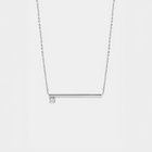 Silver necklace with a zirconium  pendant on a light gray background